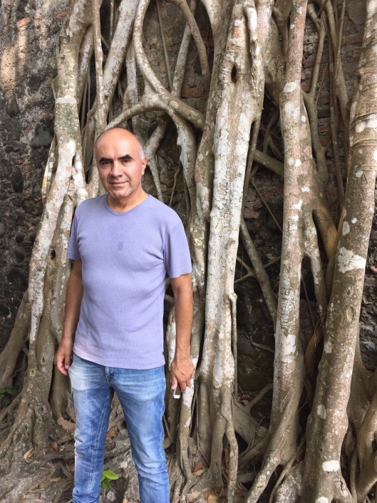 Ricardo by a banyan tree in Antigua.